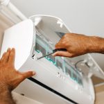 close-up-of-repairman-fixing-air-conditioner-in-a-2021-09-03-17-24-01-utc-min